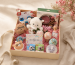 What is a gift hamper - open linen-lined Giftribute hamper showing layered contents